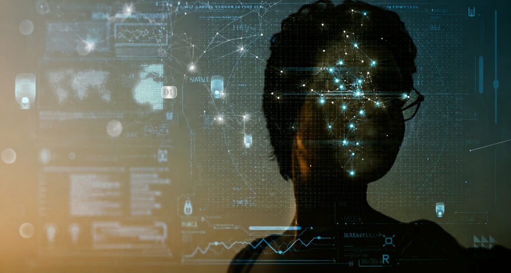 Silhouette d’une personne devant une interface futuriste avec visualisation de données et réseau neuronal numérique en surimpression.